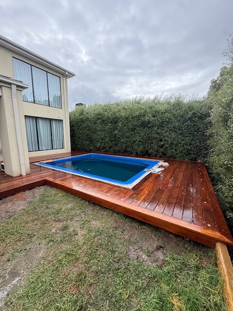 Finished hardwood pool surround deck